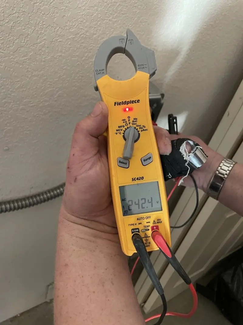 Voltage testing with clamp meter during Recessed Lighting Installation in Findlay